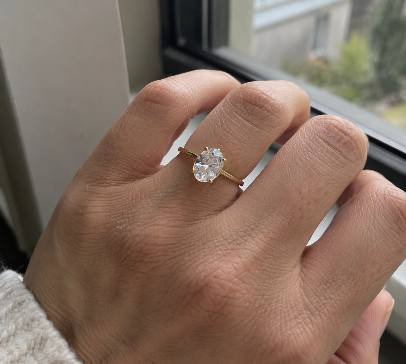 Gold Solitaire Ring by the Window.png