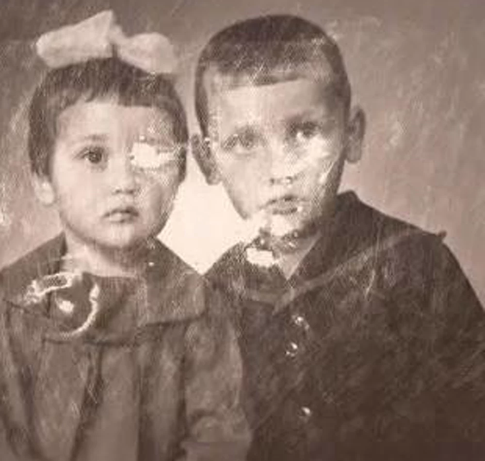 Photo restoration. A damaged family photo.